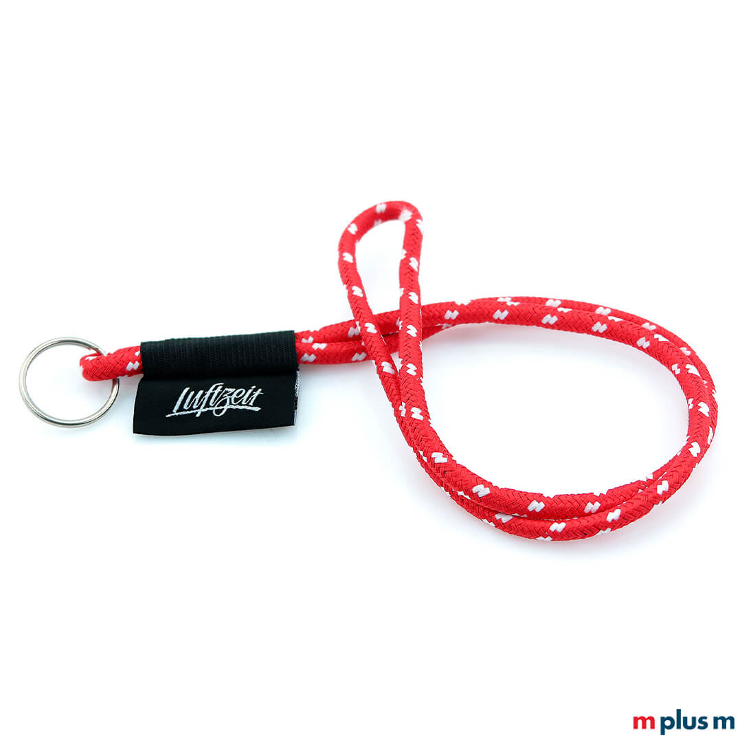 Rotes Schlüsselband aus Kordelband mit Logo auf gewebtem Etikett als Werbeartikel